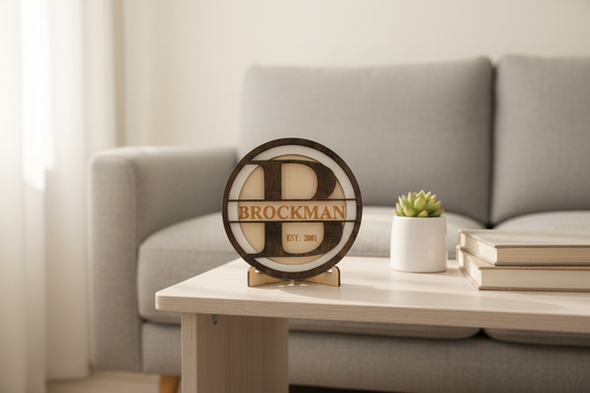 Brockman family name wood medallion displayed on an end table in a modern den
